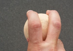 John Holdzkom used to hold his fingers apart when he threw his fastball.